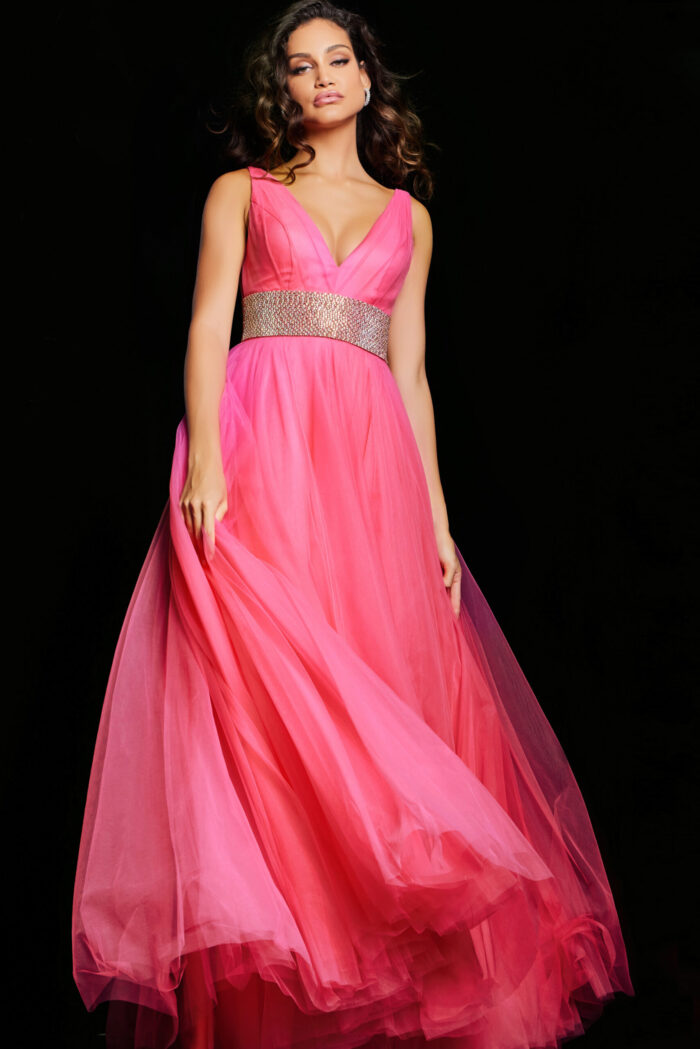 Model wearing Jovani 24564 hot pink gown, emphasizing embellished waistband, twirl view.
