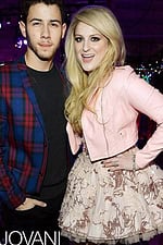 Model wearing Jovani 88259 blush dress with floral embroidery, shown with companion.