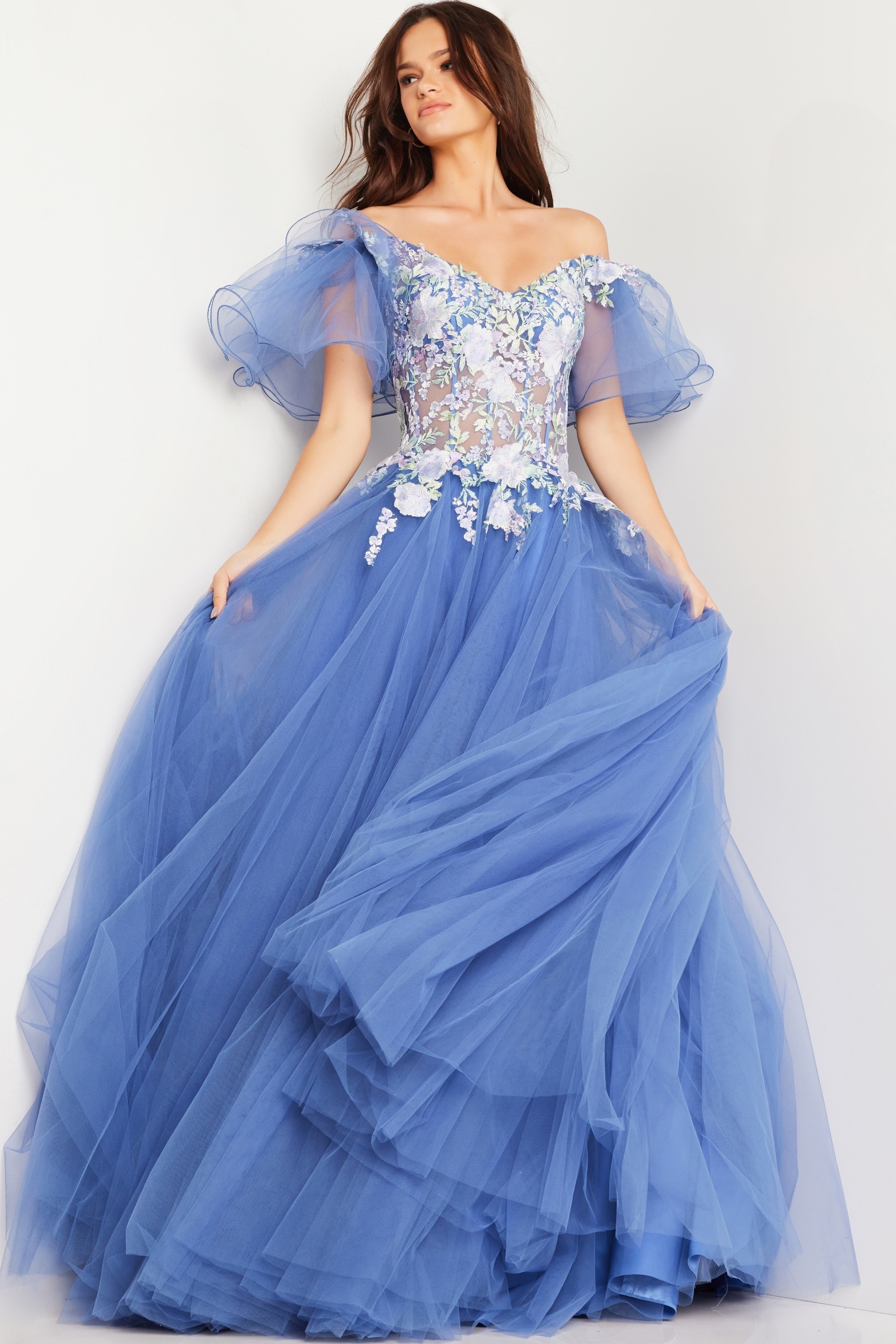 24575_ballgown.jpg Model wearing Jovani 24575 blue ball gown with floral appliqués.