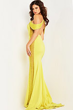 Back view of model in Jovani 24611 yellow gown showcasing the delicate beadwork.