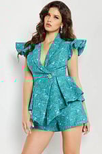 Model showing back view of Jovani 24623 blue romper with ruffled details.