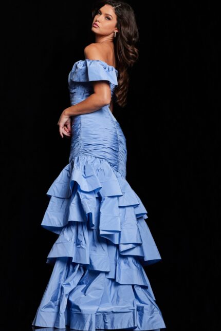 Back view of Jovani 24646 blue dress showing off-the-shoulder design and ruffled details.