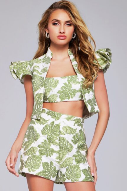 Model wearing Jovani 24649 two-piece set, front view with leaf print and ruffled sleeves.