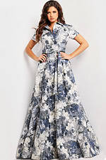 model showcasing Jovani 25664 full-length A-line gown with intricate print and belt