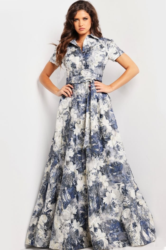 model showcasing Jovani 25664 full-length A-line gown with intricate print and belt