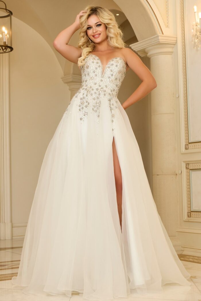Model wearing Jovani 25691 white evening gown, showing front view with high slit.