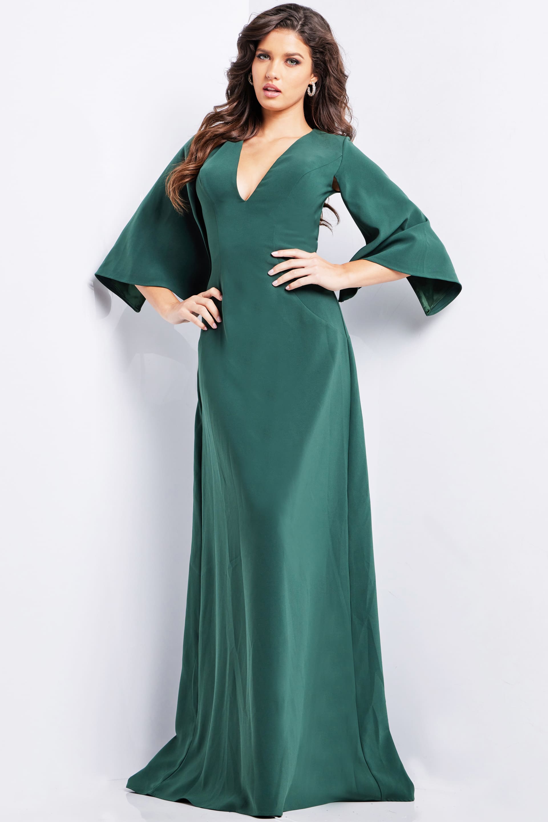 25754_HUNTER_4.jpg Model wearing Jovani 25754 elegant green gown with V-neckline and cape sleeves.