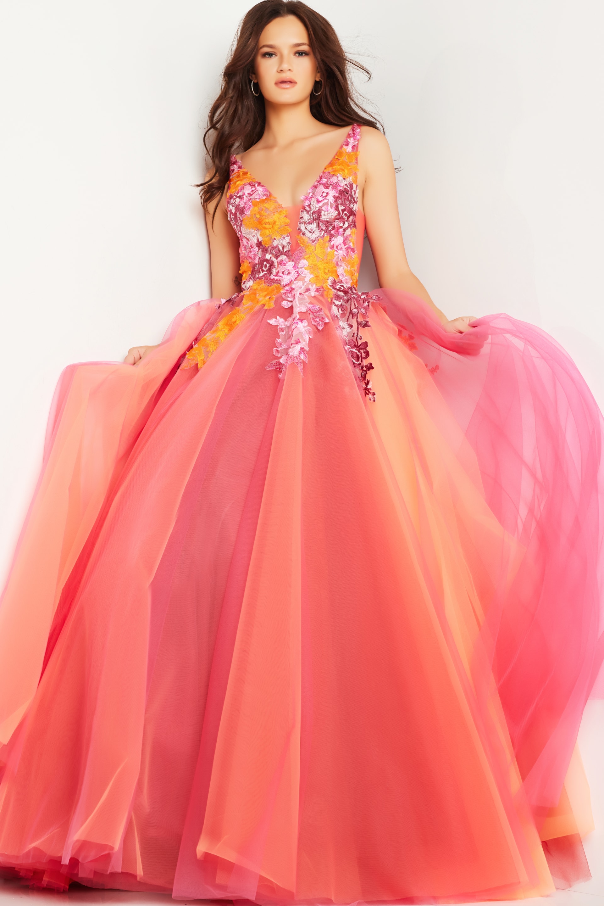 25800_1.jpg Model wearing Jovani 25800 orange A-line gown with V-neckline and floral details.