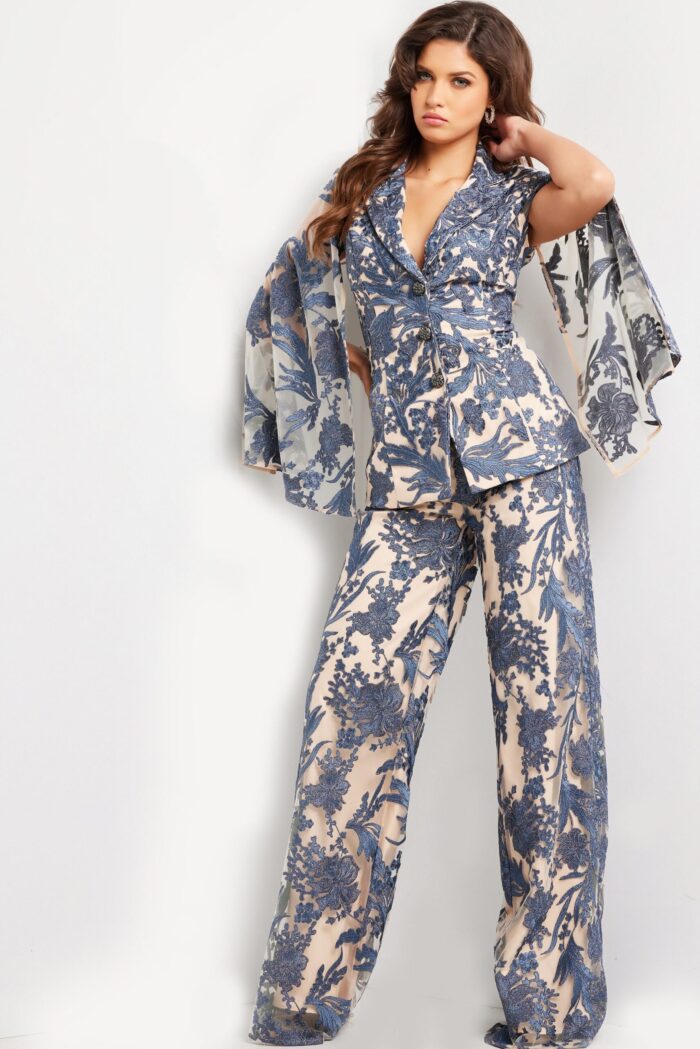 Model wearing 25805 navy dress with full-length pants and sheer long sleeves, front view.