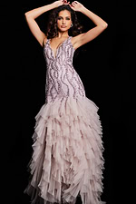 Model wearing Jovani 25853 blush dress with elaborate beadwork and layered tulle skirt.