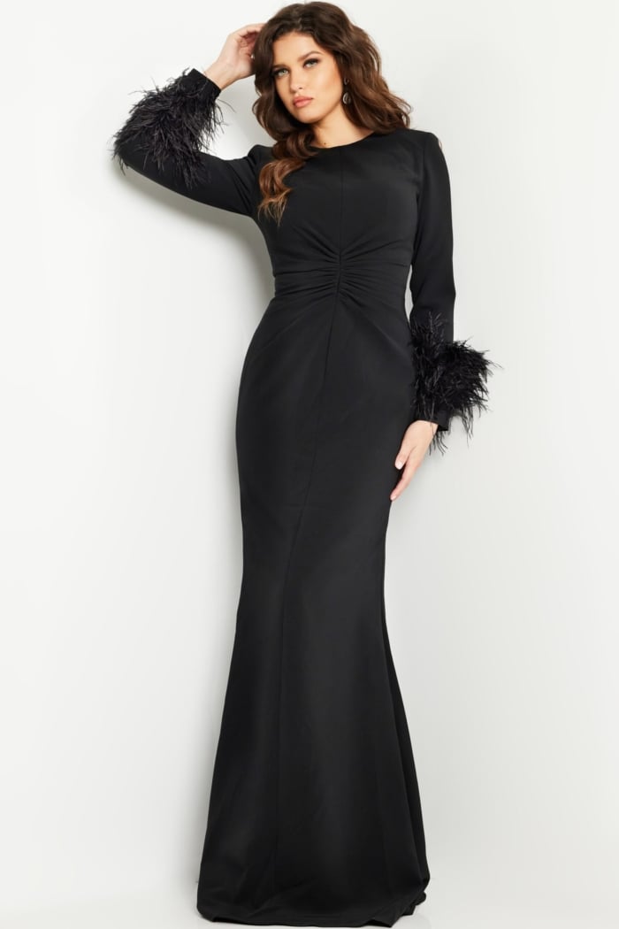 Model wearing Jovani 25898 black gown showcasing elegant silhouette and intricate design, front view.