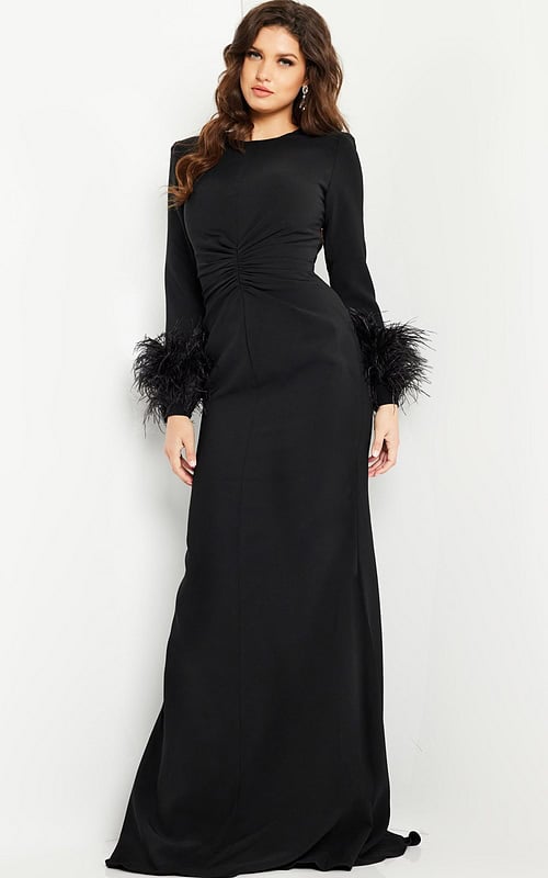 Model wearing Jovani 25898 black gown with fitted silhouette and feathered cuffs, front view.