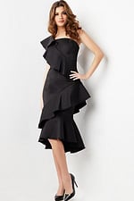 Model posing in Jovani 25971 black dress, emphasizing asymmetrical ruffle detail.