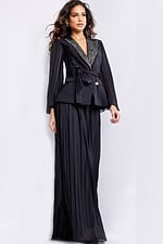 Front view of model in Jovani 26024 black gown with beaded lapel and belt.