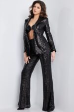 Model posing in Jovani 26042 black sequin jacket and pants set.