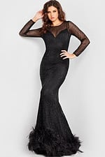 Model presenting Jovani 26047 black gown with sheer mesh sleeves.