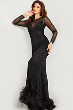 Model in Jovani 26047 black dress showcasing fringe hem detail.
