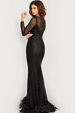 Back view of model in Jovani 26047 black gown with sheer sleeves.