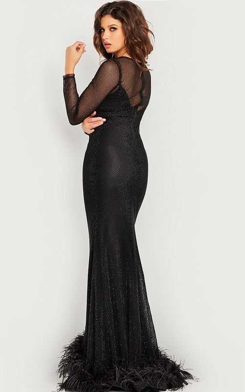 Back view of model in Jovani 26047 black gown with sheer sleeves.