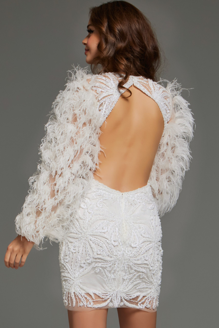 Back view of model wearing Jovani 26056 with open back design in off-white.