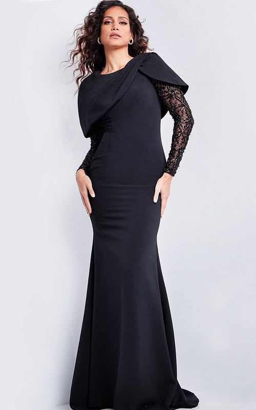Model wearing Jovani 26062 elegant black floor-length dress with lace sleeves and unique neckline.
