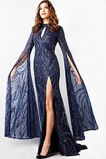 Model wearing Jovani 26092, a navy gown with high neckline and sheer long sleeves.
