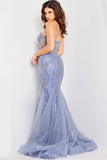 Model wearing Jovani 26112 blue dress back view displaying elegant design.
