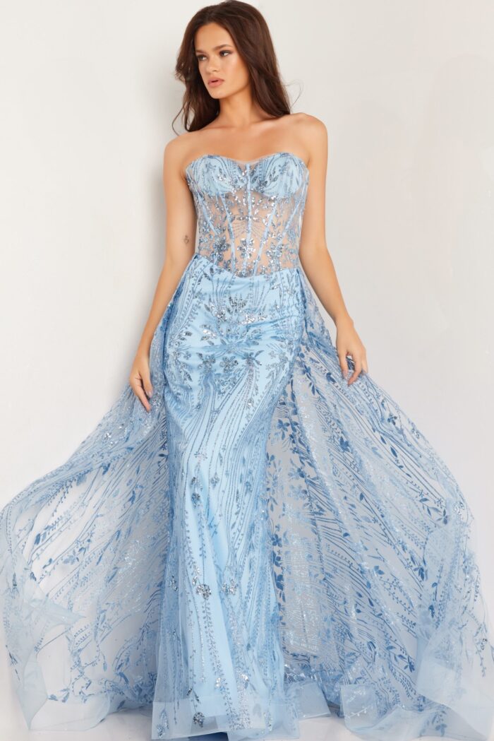 Model in Jovani 26113 blue gown with intricate sequin design, front view.
