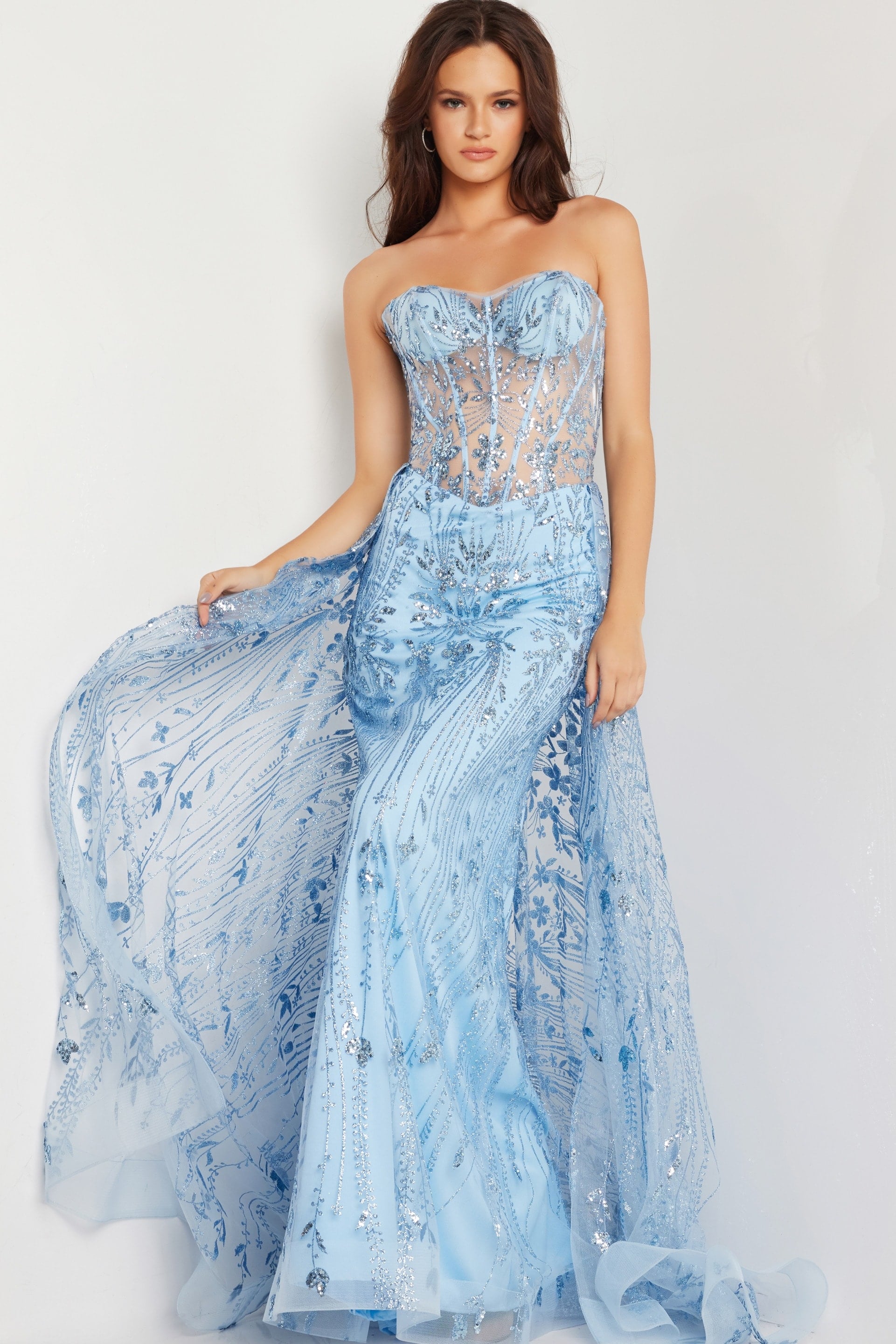 26113_4.jpg Model wearing Jovani 26113 blue dress with sheer bodice and sequin details, front view.