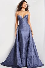 Model in Jovani 26115 gray gown with sweetheart neckline and rich texture.
