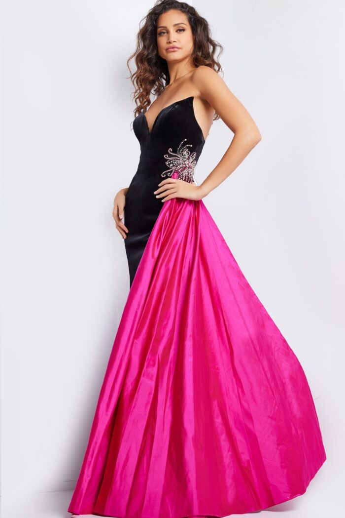 Model wearing Jovani 26117 black gown with sweetheart neckline and vibrant fuchsia train, front angle view.