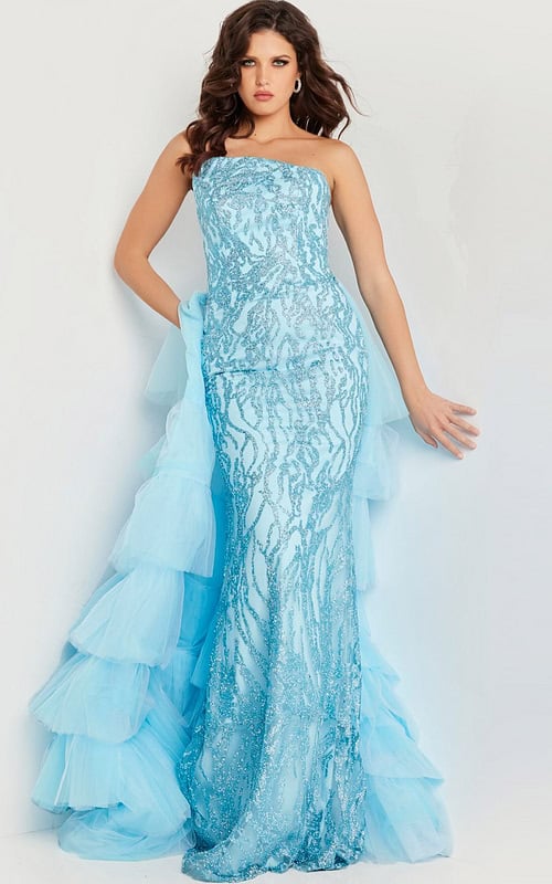 Model wearing Jovani 26119 blue dress with strapless neckline and layered tulle train, front view.