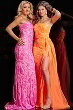 Close-up of two models in Jovani 26134 pink and orange dresses with detailed embellishments.