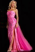 Model wearing Jovani 26134 pink dress showcasing intricate floral details.
