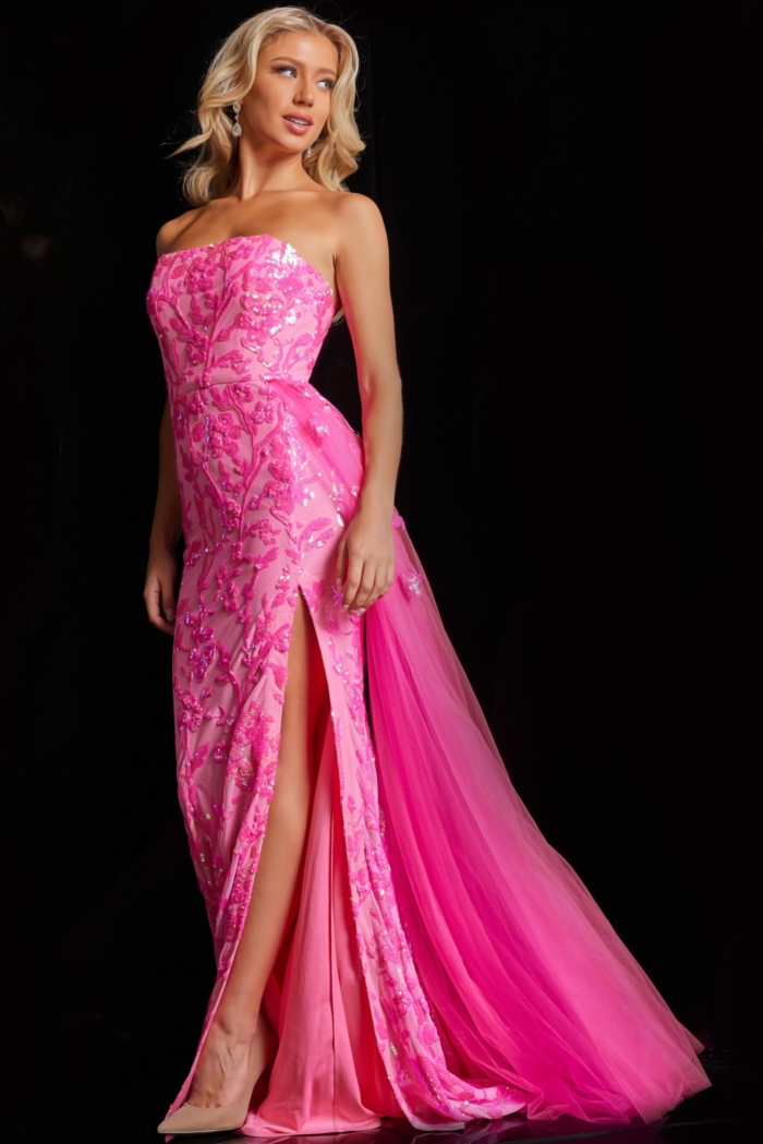 Model wearing Jovani 26134 pink dress showcasing intricate floral details.