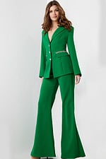 Model wearing Jovani 26144 full-length green pantsuit with V-neckline.