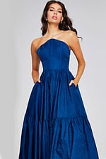 Model wearing Jovani 26152 with a navy A-line strapless gown, front view, upper body focus.