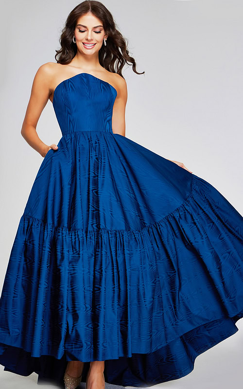 Model wearing Jovani 26152 with a navy A-line strapless gown, front view, full-length.