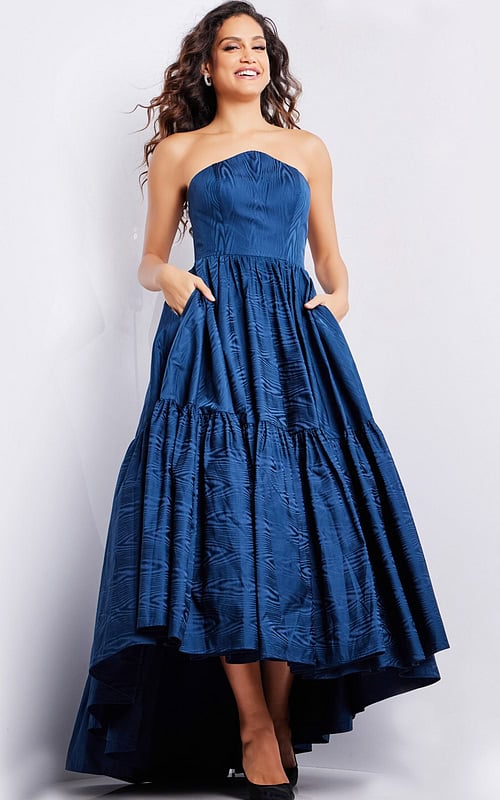 Model wearing Jovani 26152 navy dress featuring a high-low hemline.