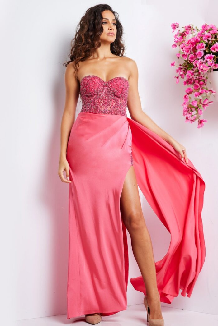 Model showcasing the Jovani 26165 pink gown's elegant design and high slit