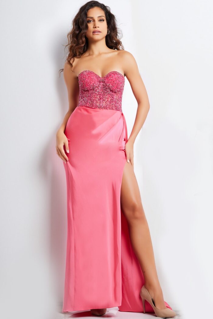 Model wearing Jovani 26165 pink gown with sweetheart neckline, fitted bodice, and high slit