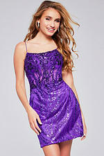 Model wearing Jovani 26183 purple dress intricate detailing, front view.