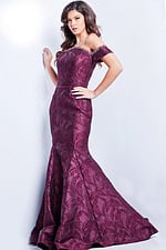 Model wearing Jovani 26231 burgundy mermaid gown with off-the-shoulder neckline and embellished details.