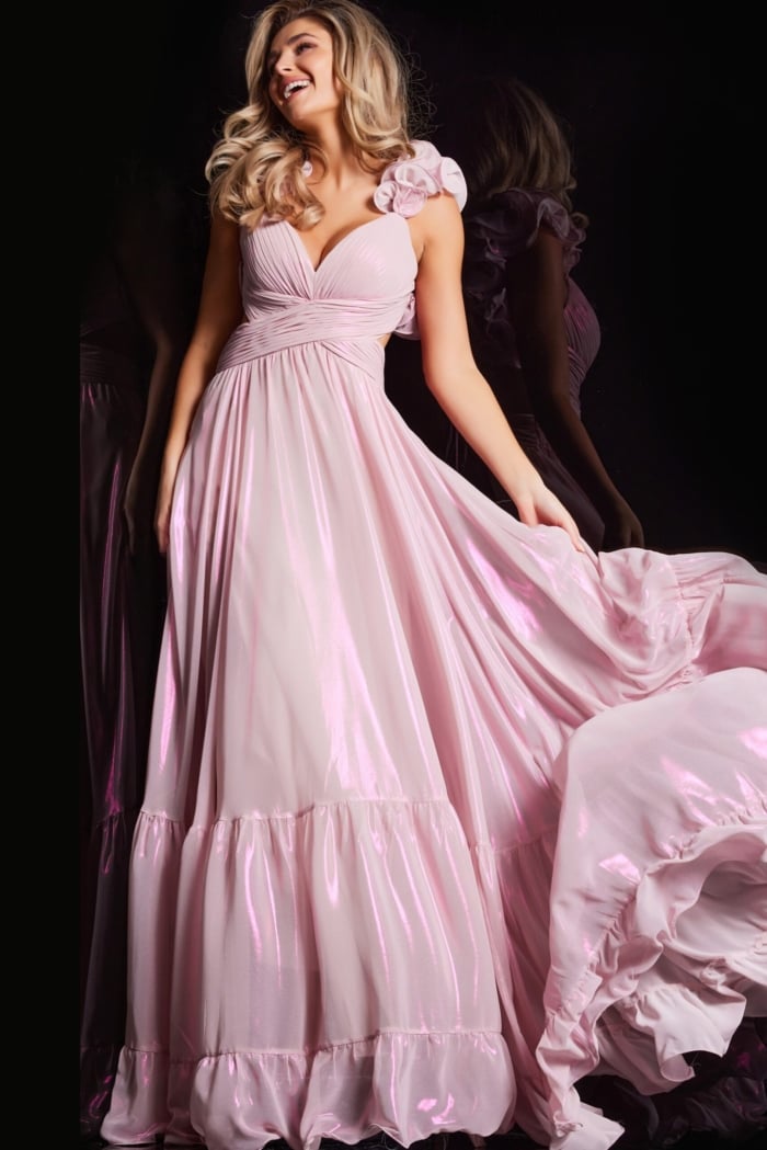 Model wearing Jovani 26248 pink dress, showing v-neckline and floral accents.
