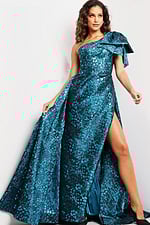 Model wearing Jovani 26254 blue one-shoulder gown with high slit and bow detail from the front.