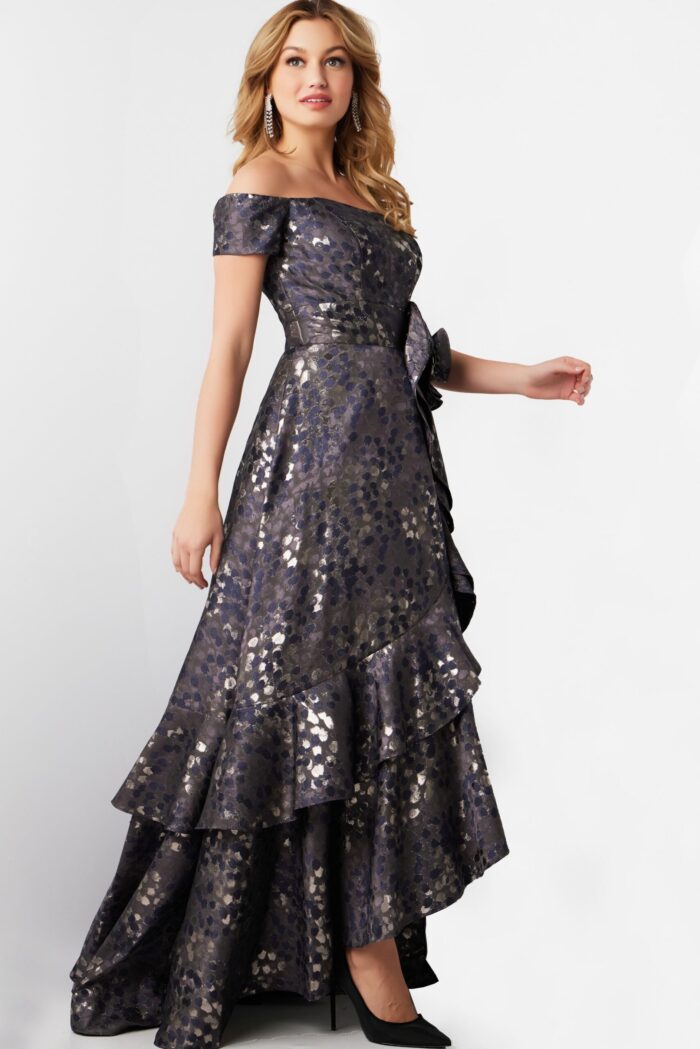 Model wearing Jovani 26256 gray off-the-shoulder dress with rosette detail