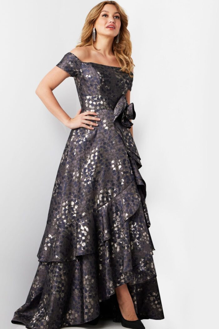 Model in Jovani 26256 gray dress showing off-the-shoulder design with ruffles