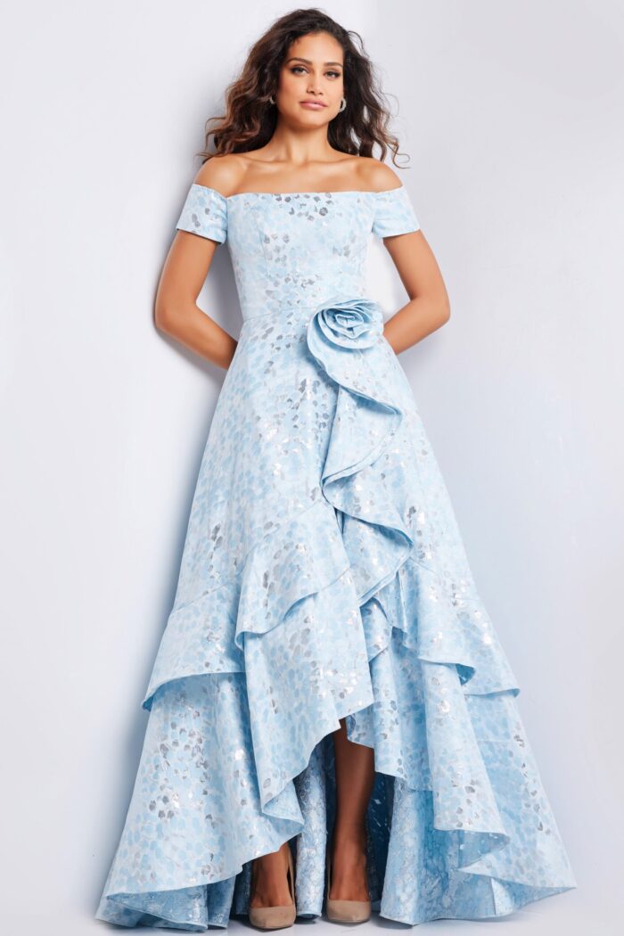 Model in light blue Jovani 26256 dress featuring rosette and ruffles
