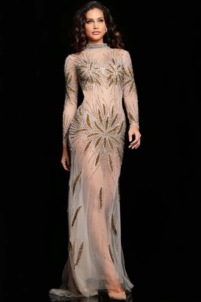 Model wearing Jovani 26257 nude gown with gold embellishments, front view walking.