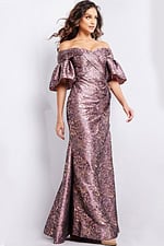 Model in Jovani 26258 gold gown with floor-length mermaid silhouette, front view.